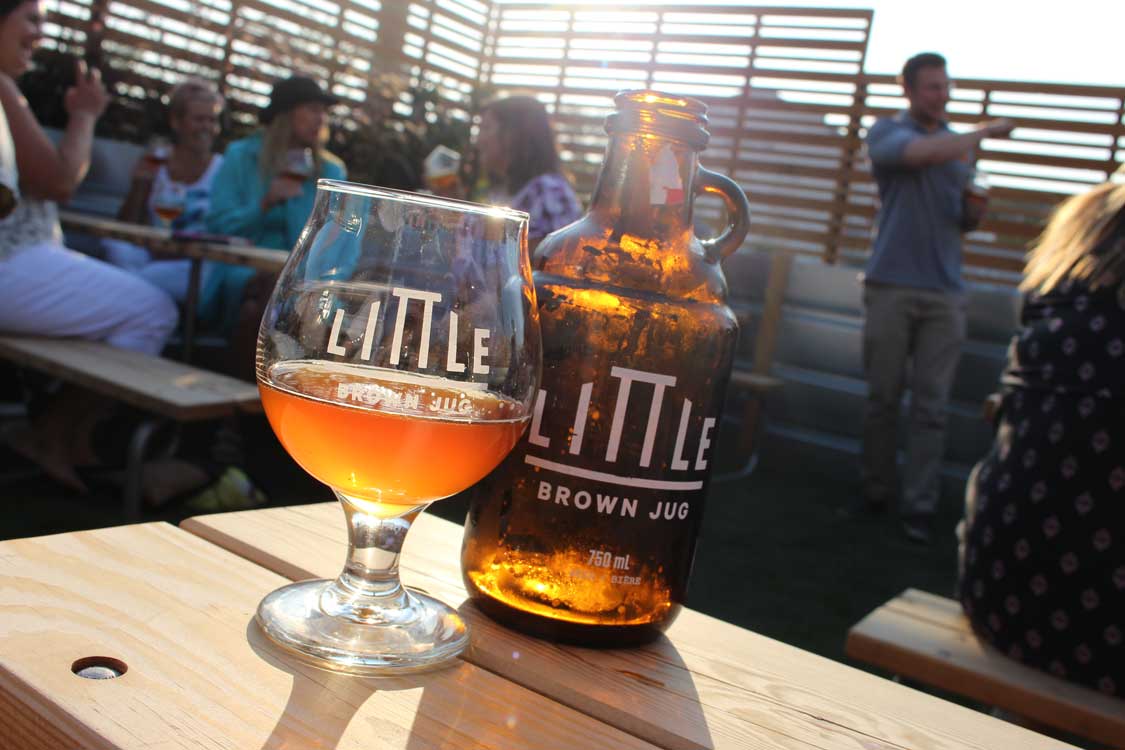 Little Brown Jug beer on a patio table