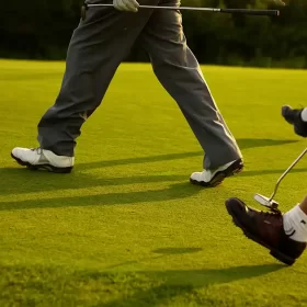 Men walking across the Deer Valley course while golfing in Saskatchewan