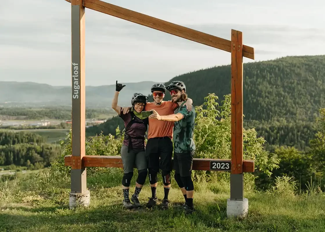 Mountain bikers posing for a selfie on Sugarloaf